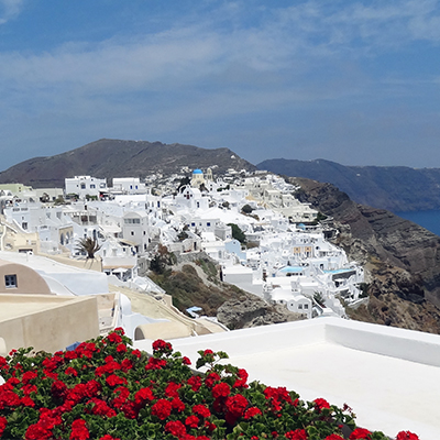 Greece mountains, white houses, water, red geraniums