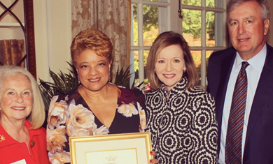 Four people including Ruth G Shaw, Linda Lockman-Brooks, Dr. Kandi Deitemeyer, and Westom Andress. Linda is holding a framed award.