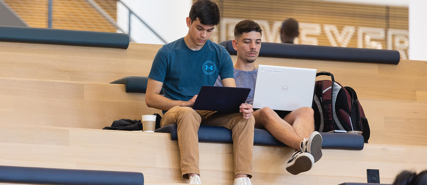 Two students on the collaboration stairs in the Parr Center