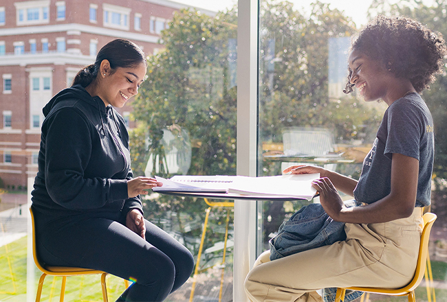 Two students smiling in the Parr Center