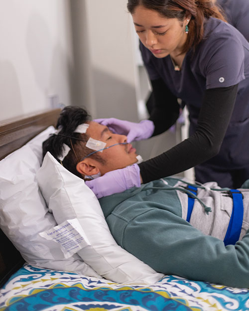 A student and patient in the polysomnography lab