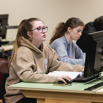 Two Central Piedmont students in a computer lab