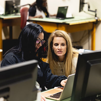 Two Central Piedmont students working together on a laptop