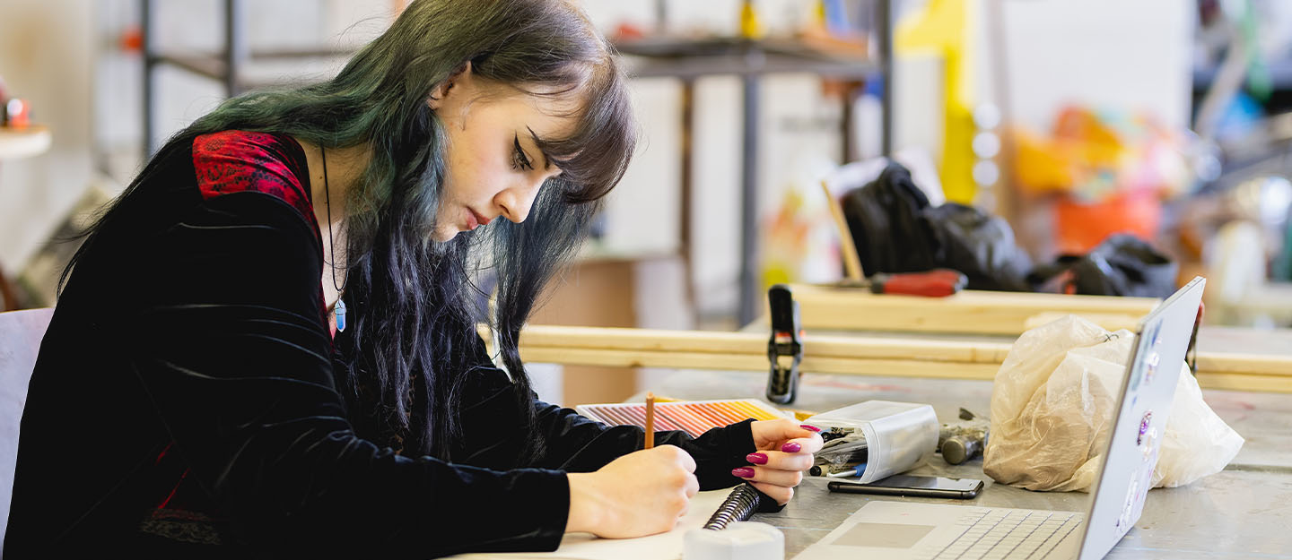 A Central Piedmont student in an art classroom