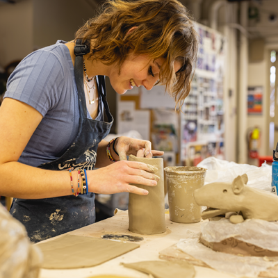 Central Piedmont Art student working with clay