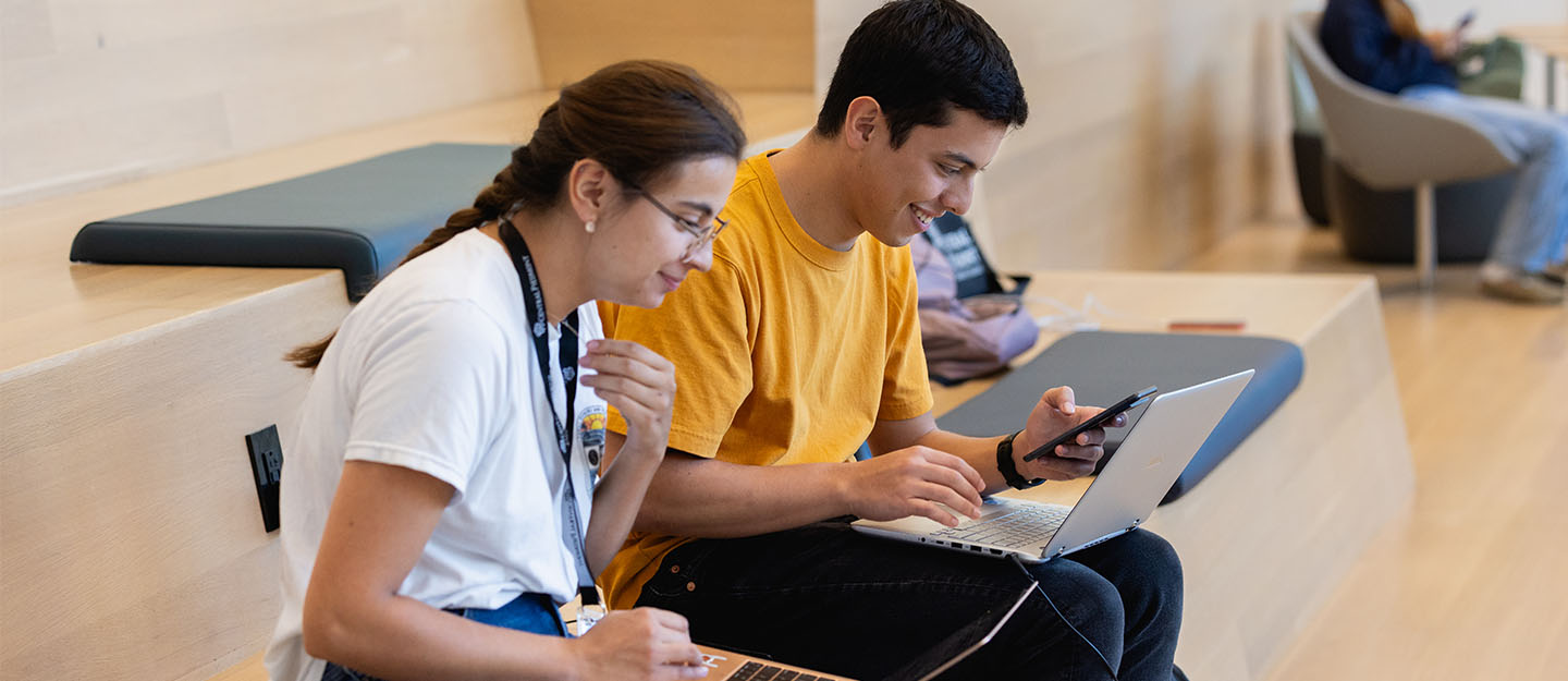 Two students working on their laptops at the Parr Center at Central Piedmont on the first day of classes fall 2023