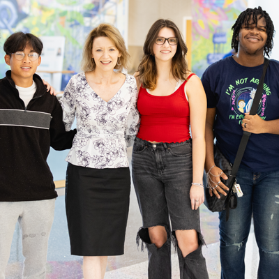 Students in the Parr Center with president of college