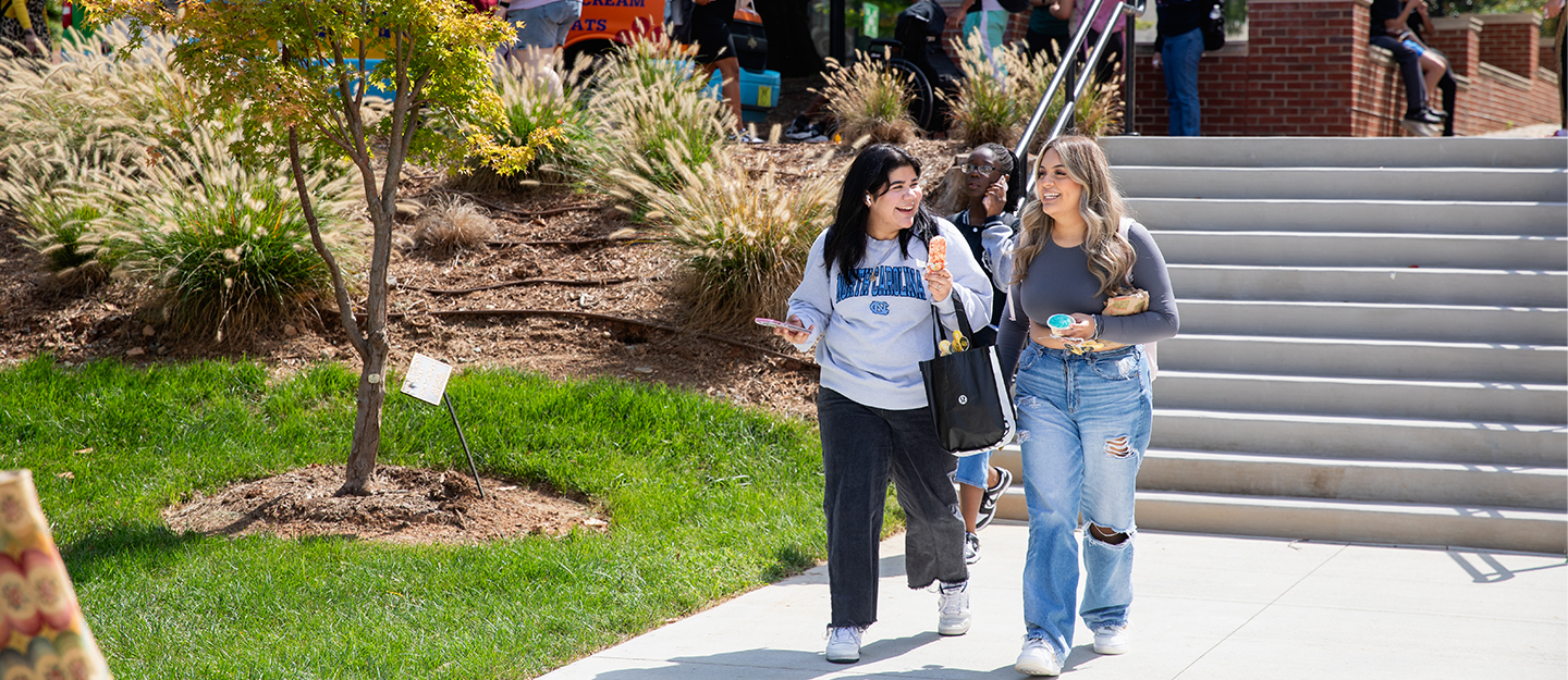 Laughing students walking toward Parr Center