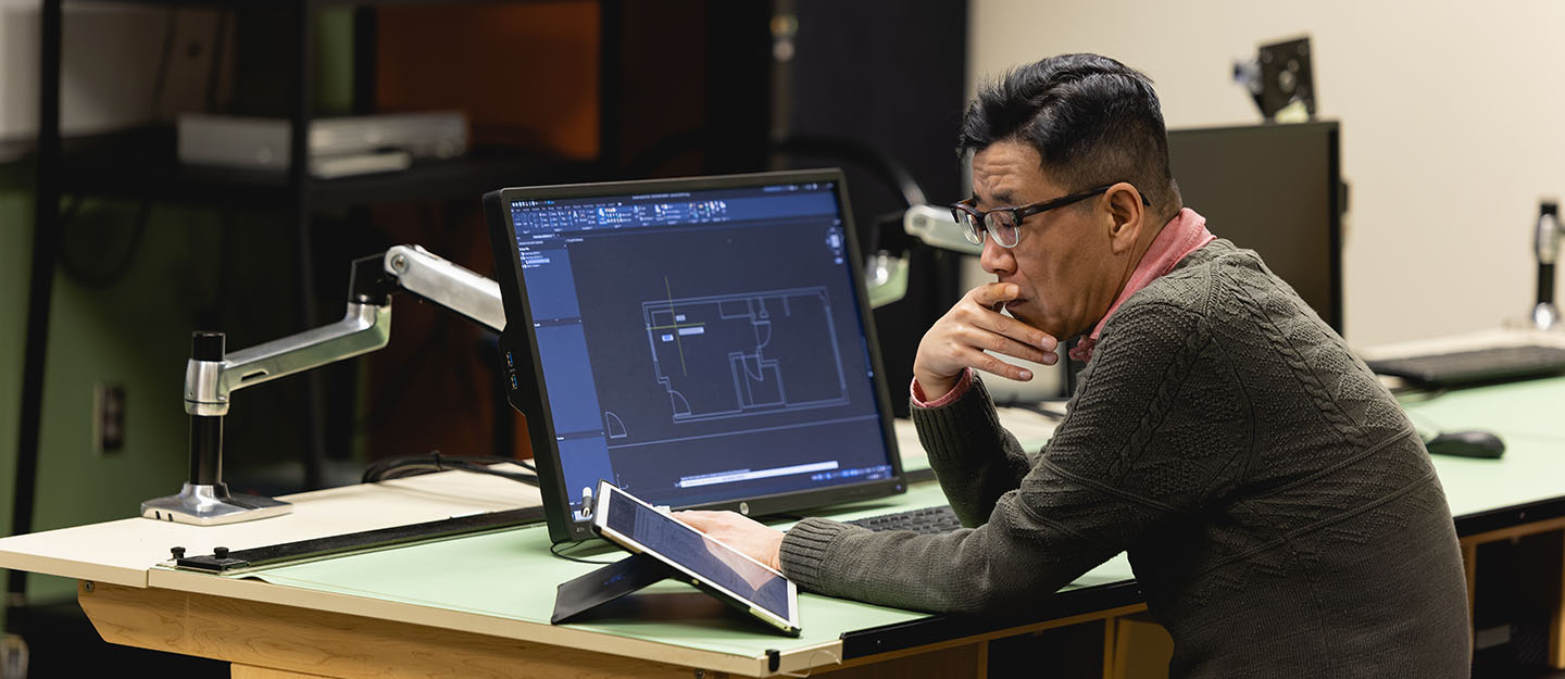 design and architecture student in front of laptop in classroom on Central Campus at Central Piedmont Community College