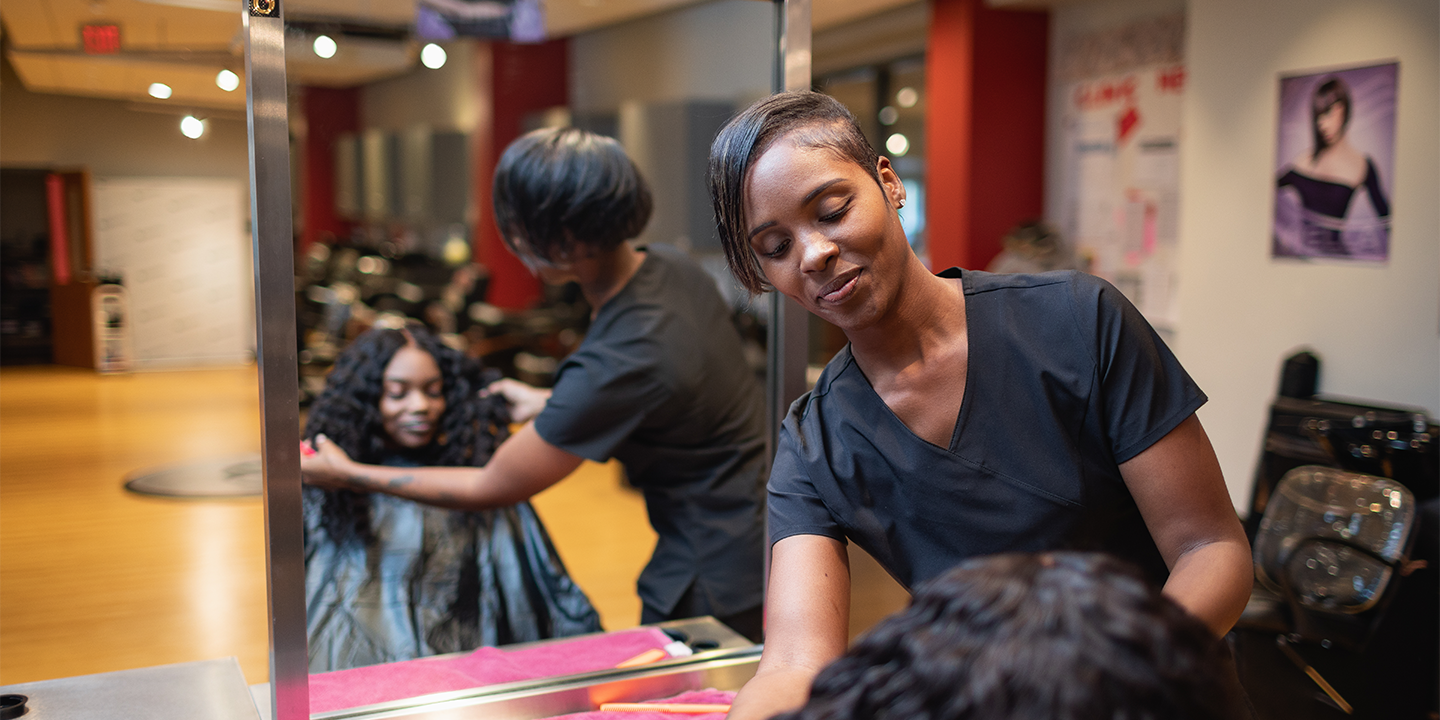 Cosmetology student doing hair 