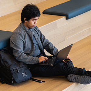 A Central Piedmont student working on a laptop in the Parr Center