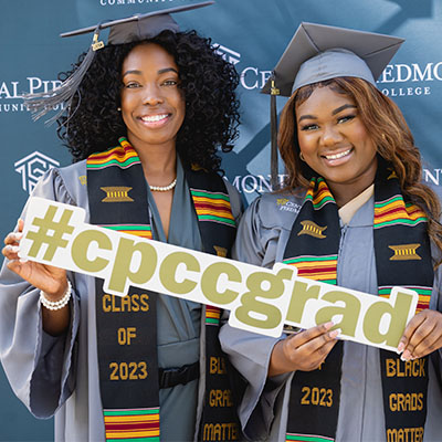 Central Piedmont Class of 2023 - two graduates in caps and gowns