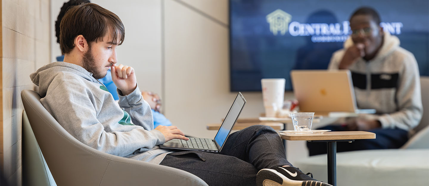 A Central Piedmont student working on a laptop