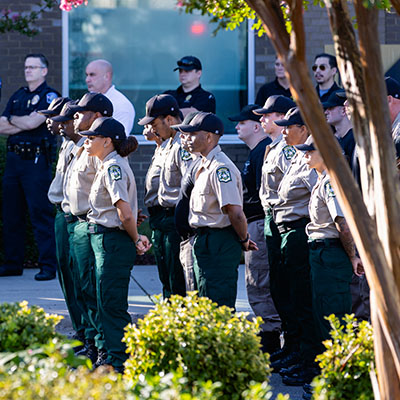 veterans day ceremony with military and law enforcement standing outside