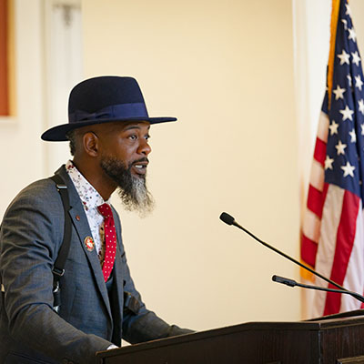 Veteran speaker at podium at Veterans Day event at Central Piedmont Community College