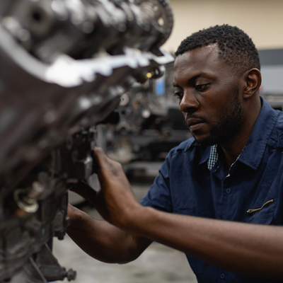 Student working on engine