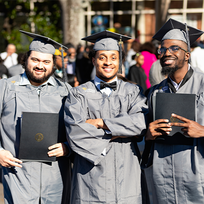 Three Central Piedmont students outside at Commencement