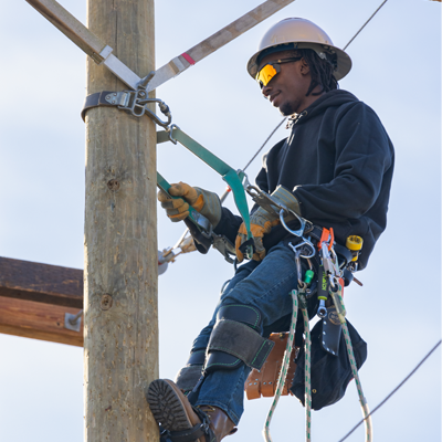 Student climbing a pole