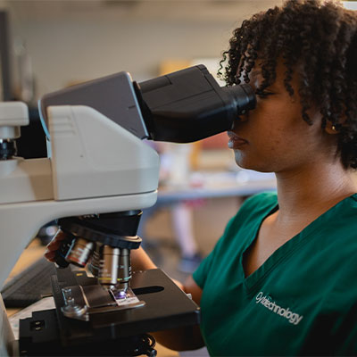 A Central Piedmont student in the cytotechnology lab