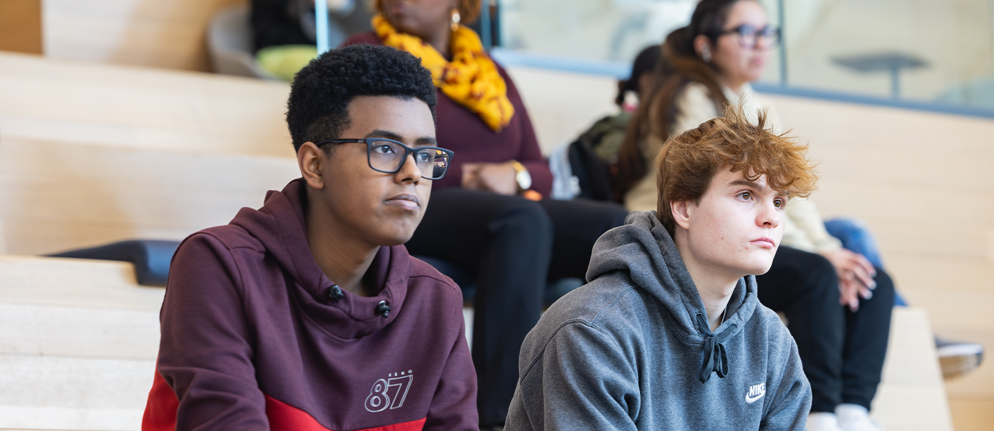Two students sitting on Parr Center steps looking forward