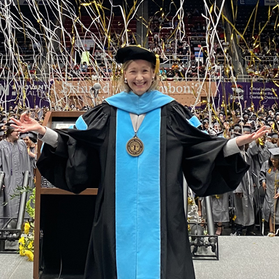 Dr. D. at graduation with streamers