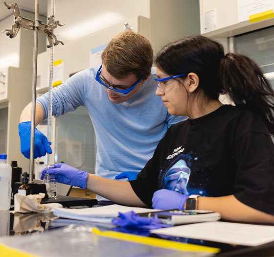 Two Central Piedmont students working in them chemistry lab