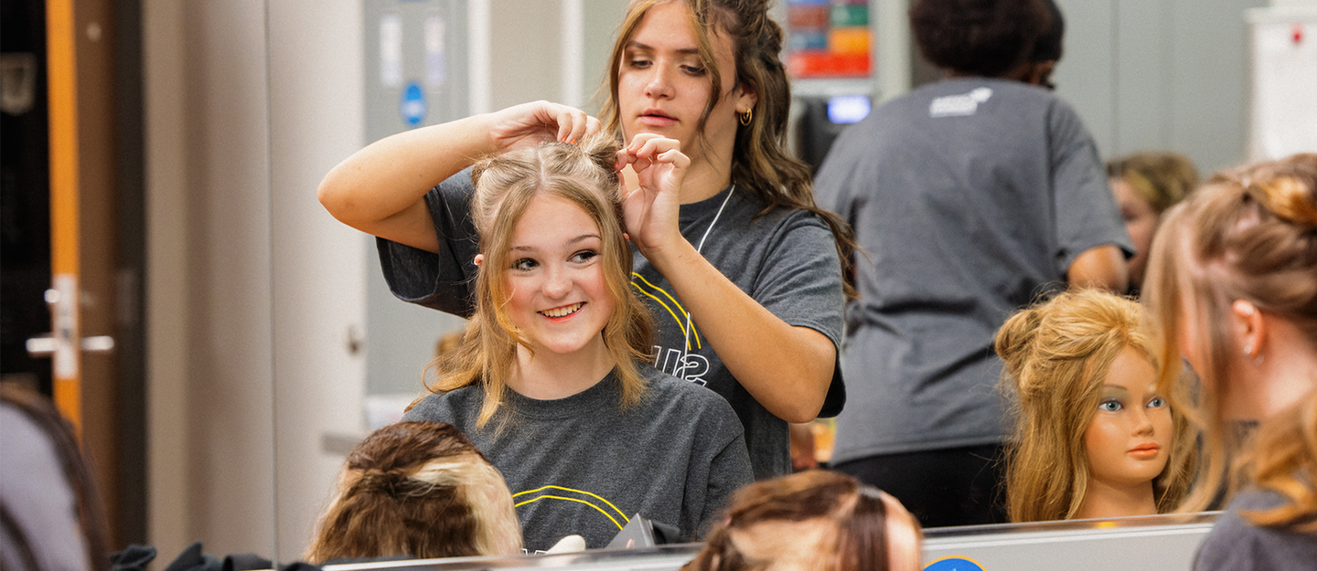 One person doing another person's hair
