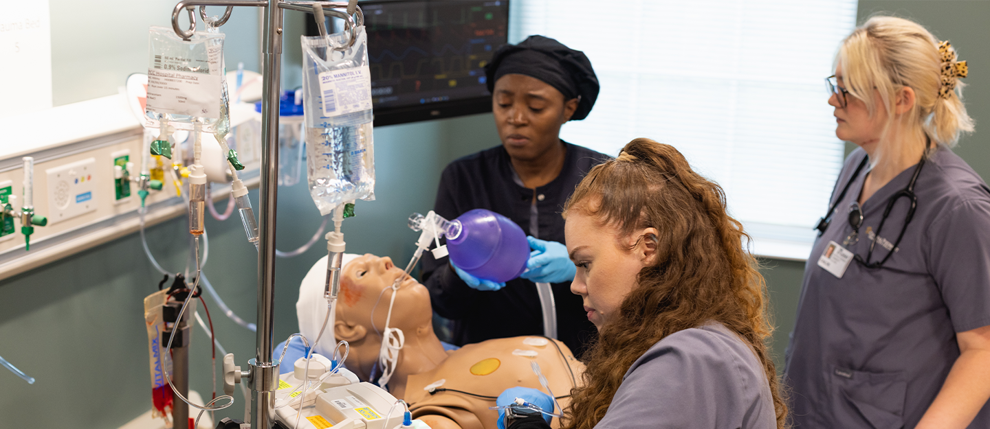 3 healthcare students working on a cadaver 