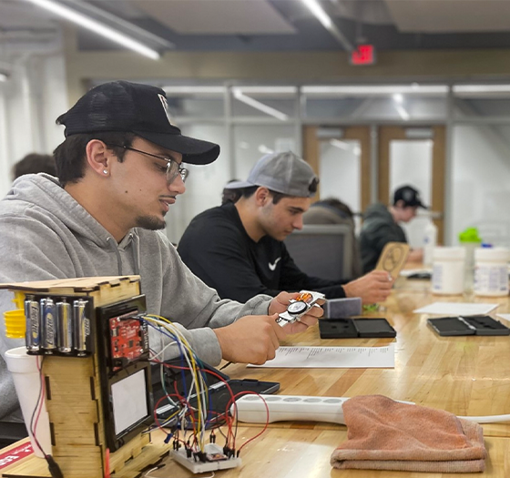 Several Central Piedmont engineering students working in the lab