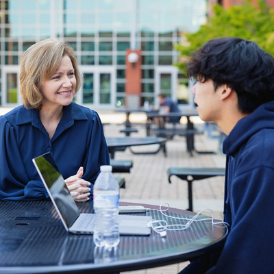 College President talking to a student
