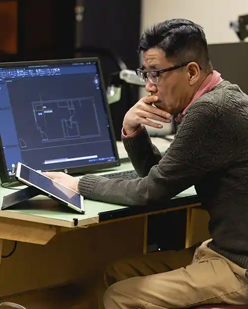 design and architecture student in front of laptop in classroom on Central Campus at Central Piedmont Community College