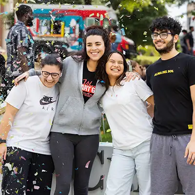 happy diverse students smiling outside celebrating at 60th anniversary of Central Piedmont