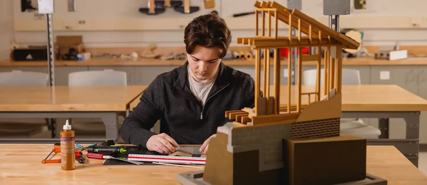 A Central Piedmont architectural technology student working on a model in the lab