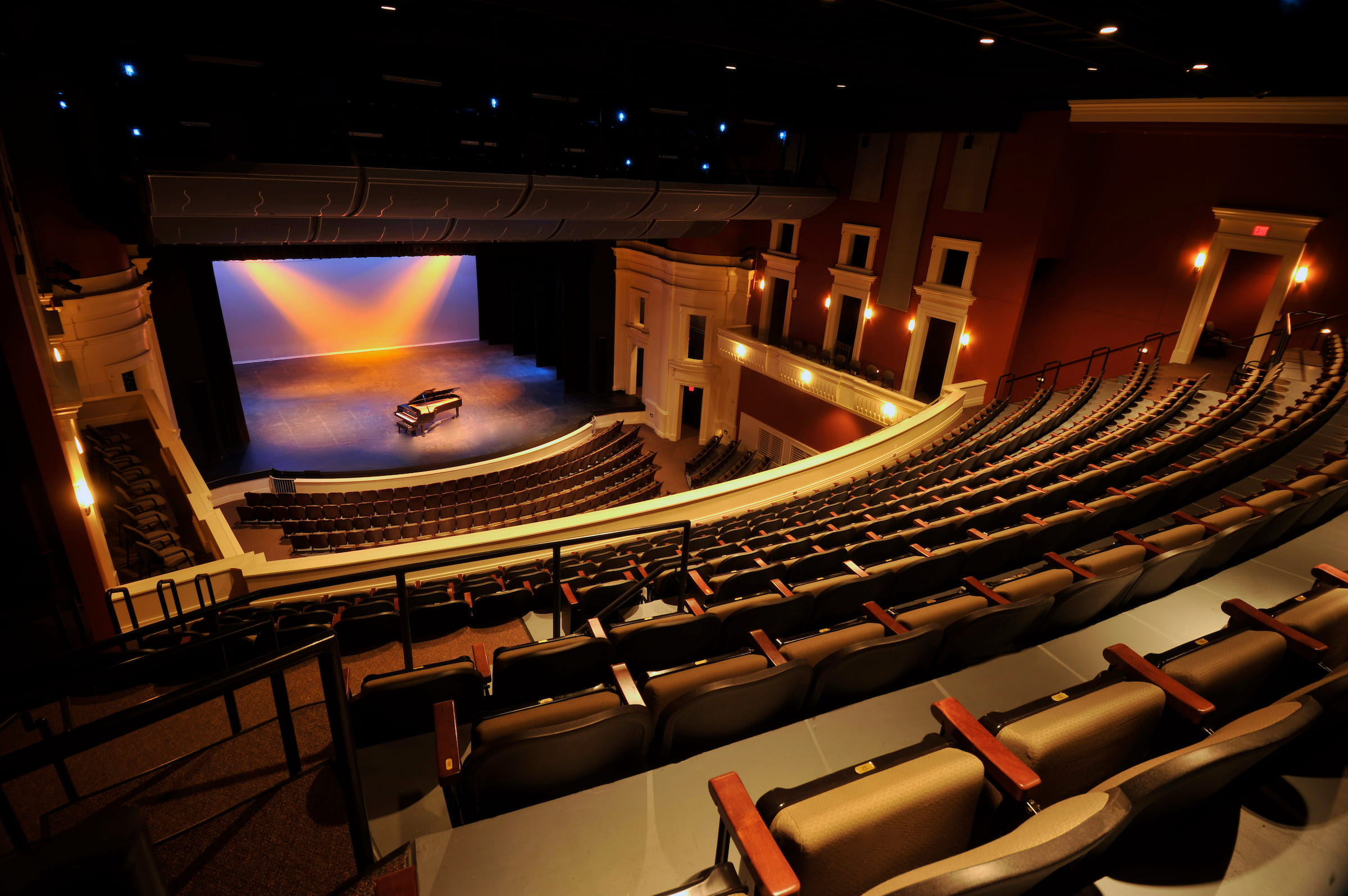 Dale F. Halton Theater auditorium with curved tiers of seating facing the lit stage