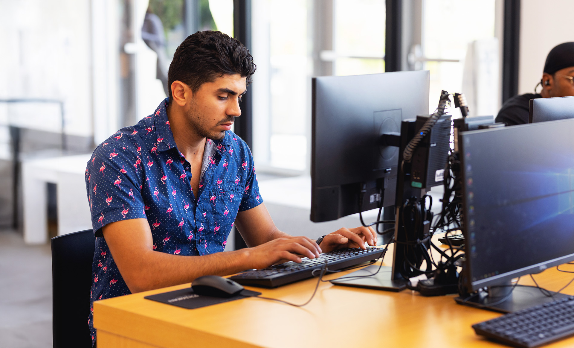 boy typing on keyboard