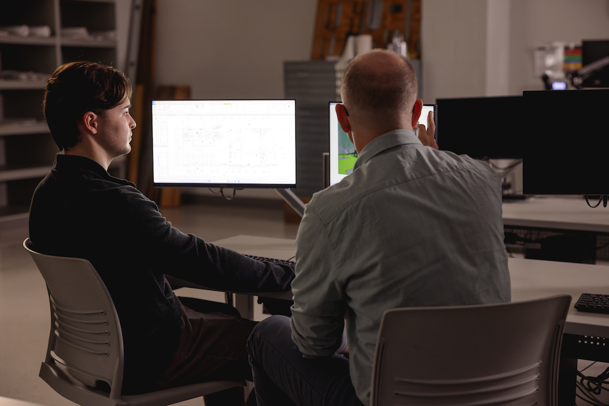 Professor offering a student one-on-one support.