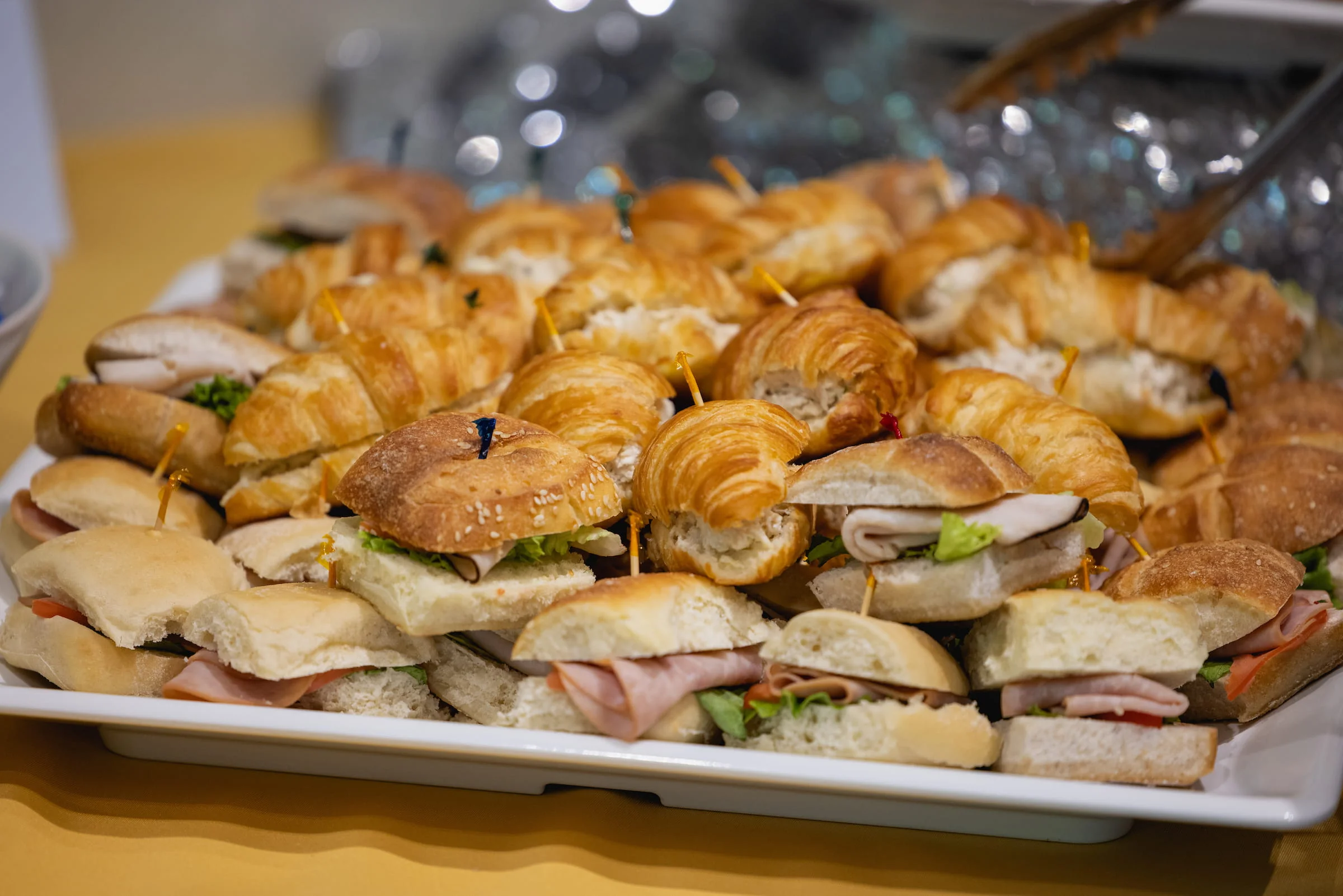 Platter of assorted sandwiches and croissants