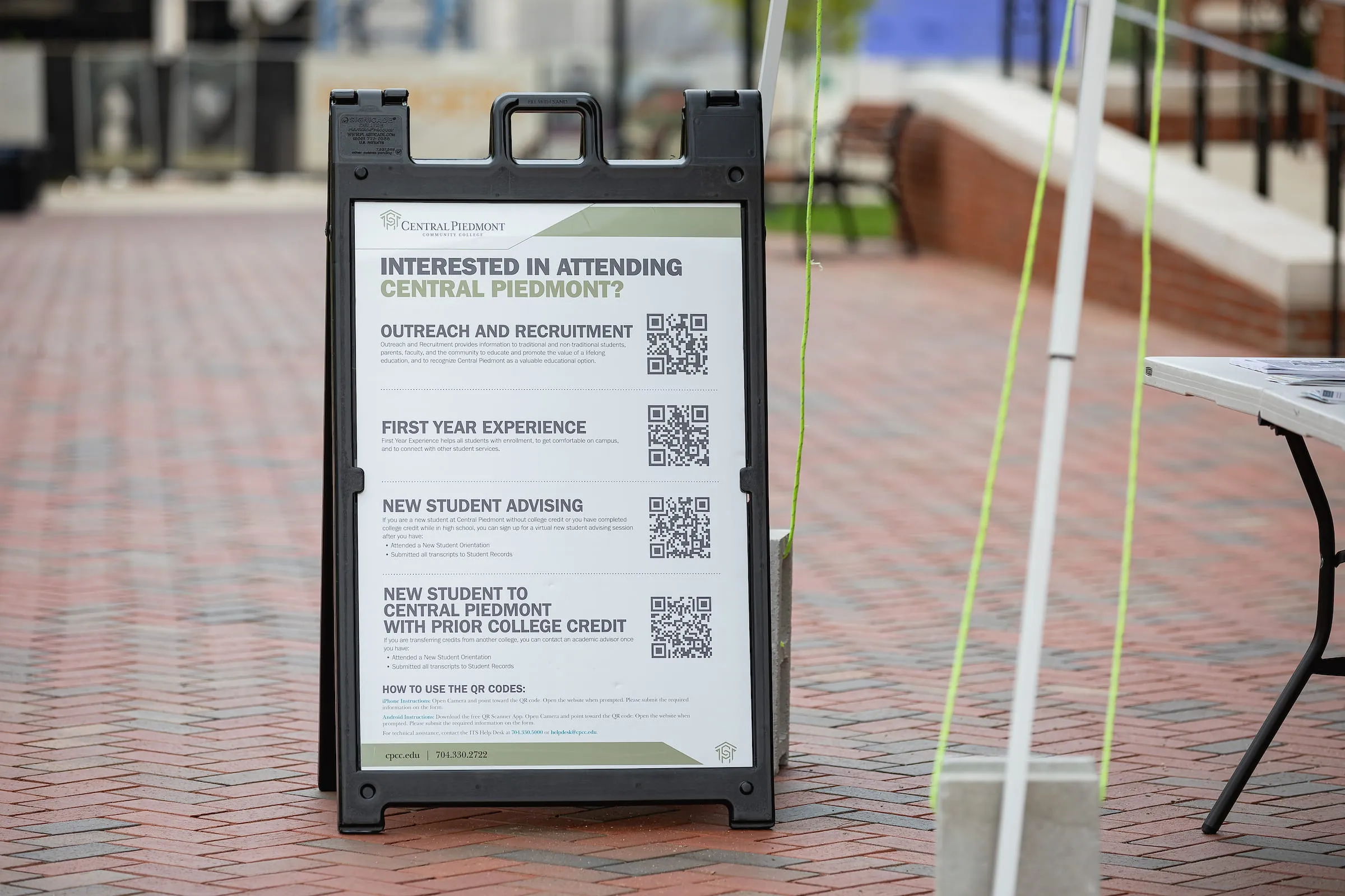 A-frame sign with QR codes for prospective Central Piedmont students