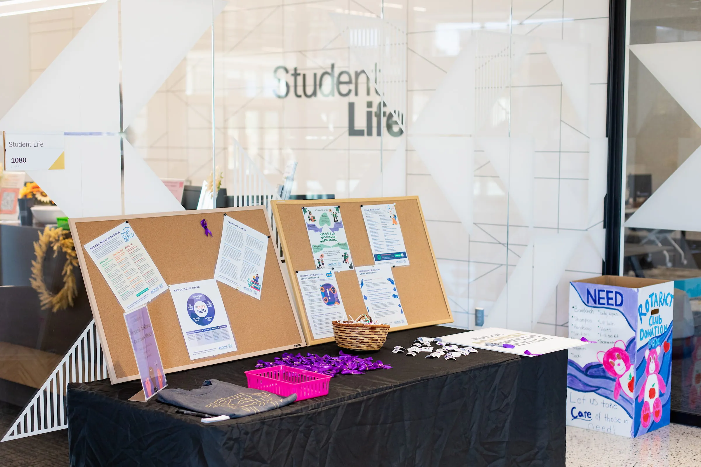 Information table with a display board of student life flyers