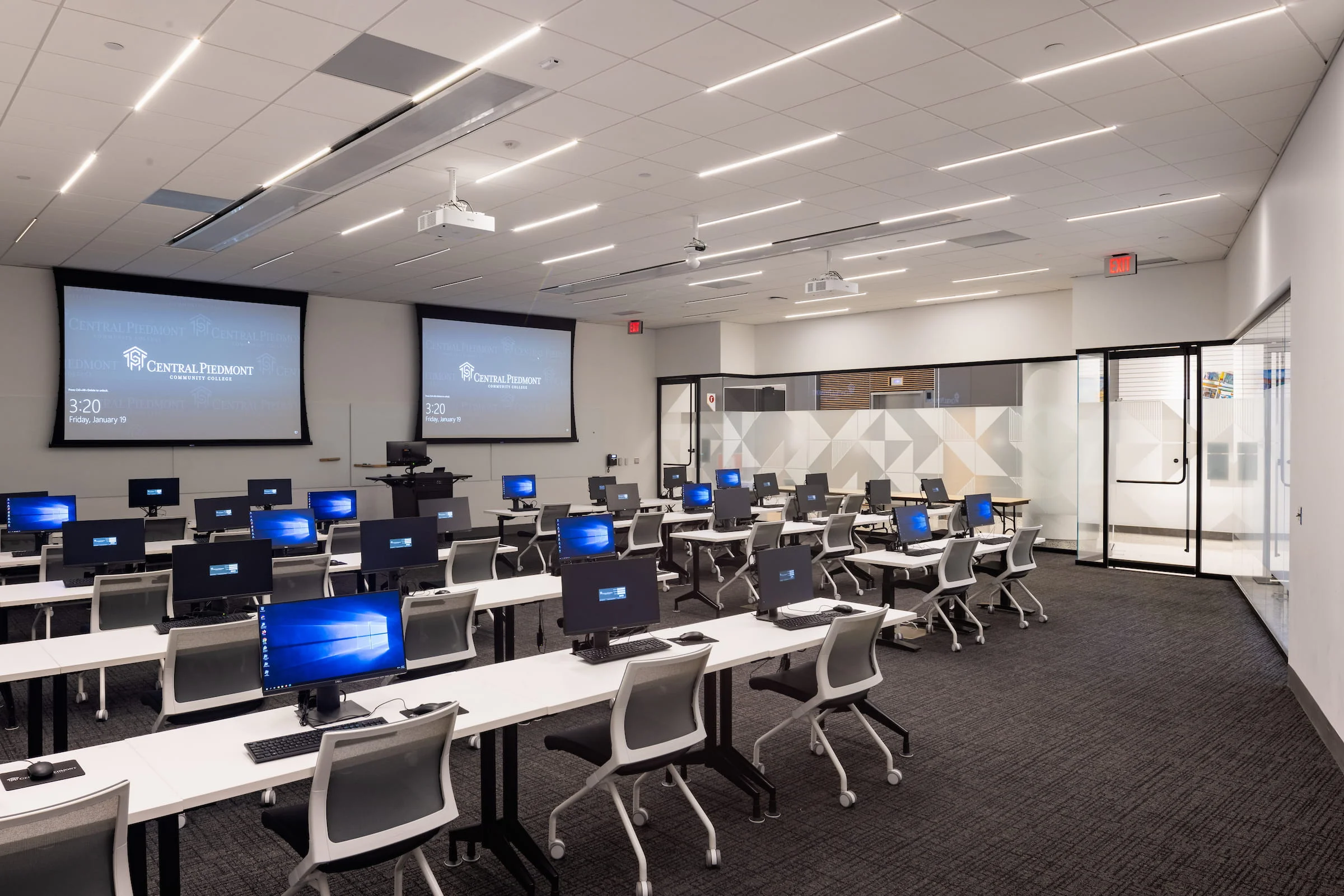 Computer lab with rows of desktop workstations