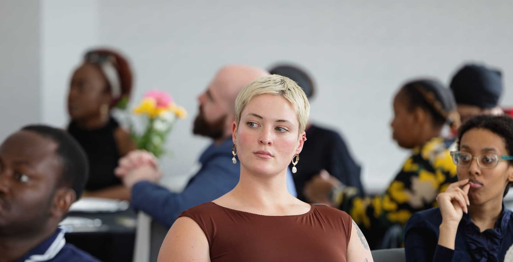 Student among attendees at a campus information session