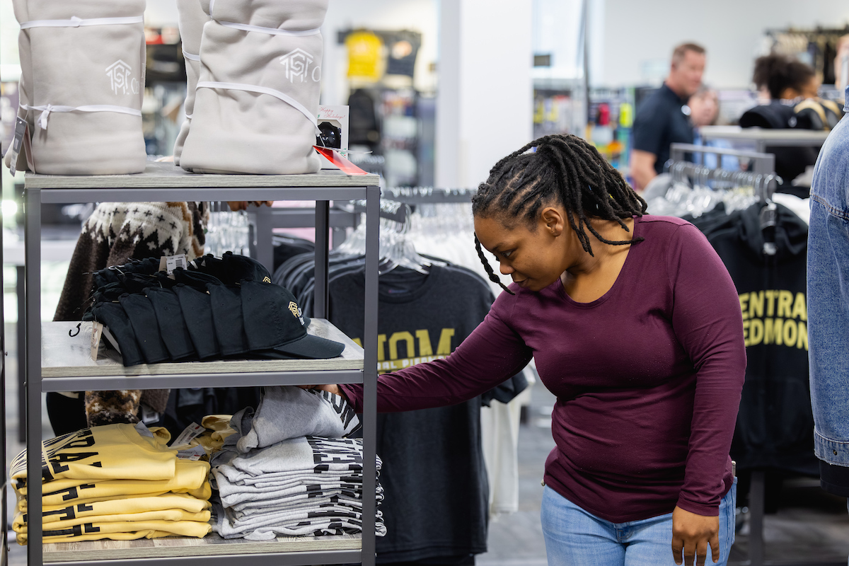 Student shopping at a campus store