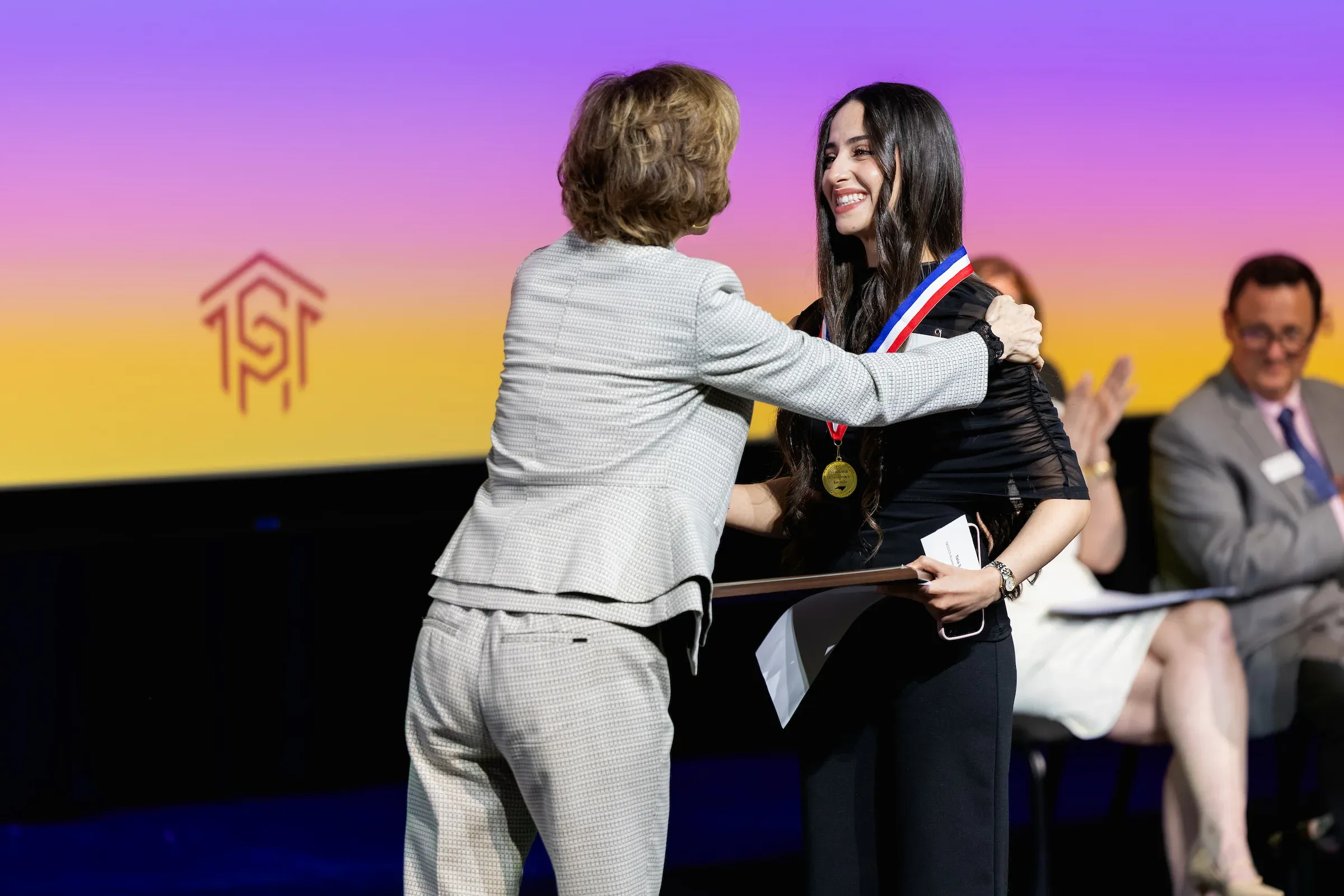 Student receiving an honour stole on stage