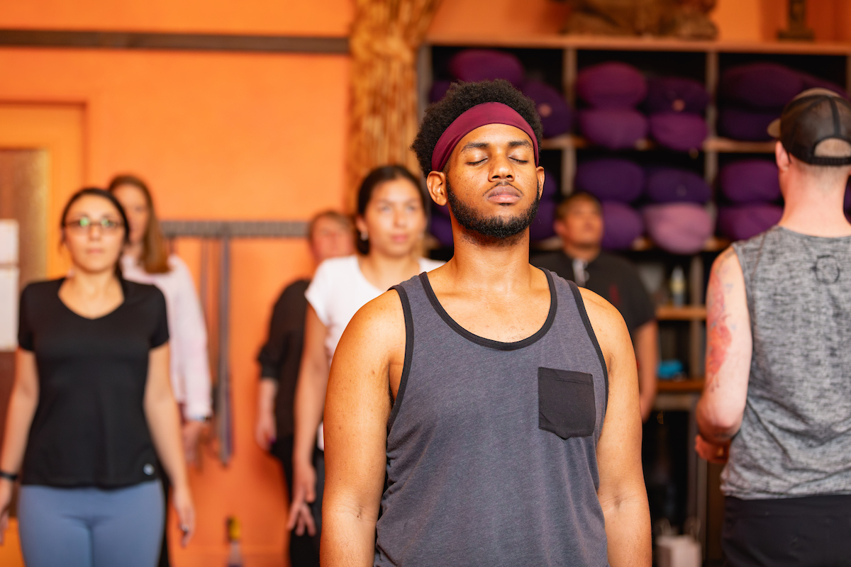 Students taking an indoor yoga class