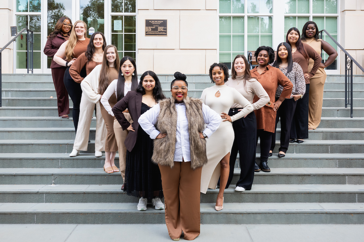 Ruth G. Shaw Leadership scholars standing in a v formation on the stairs of a building on campus.