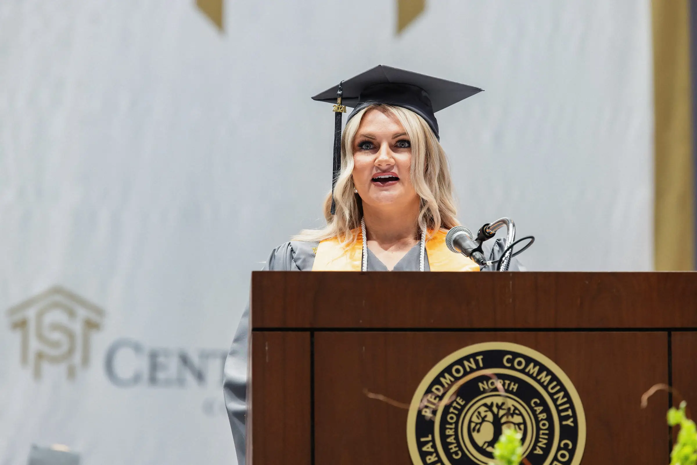 Student speaker addressing the audience from the commencement lectern