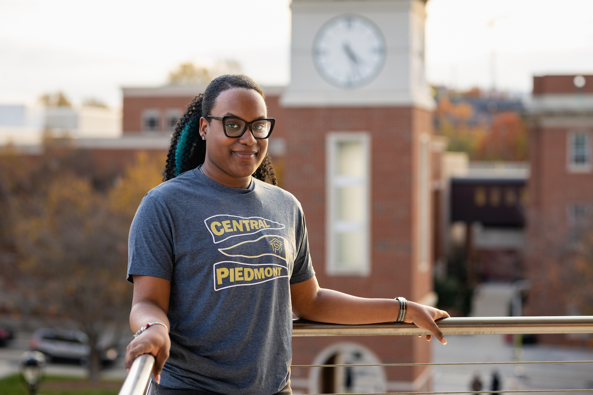 Jaison Maxwell standing in front of Tate Tower on Central Campus
