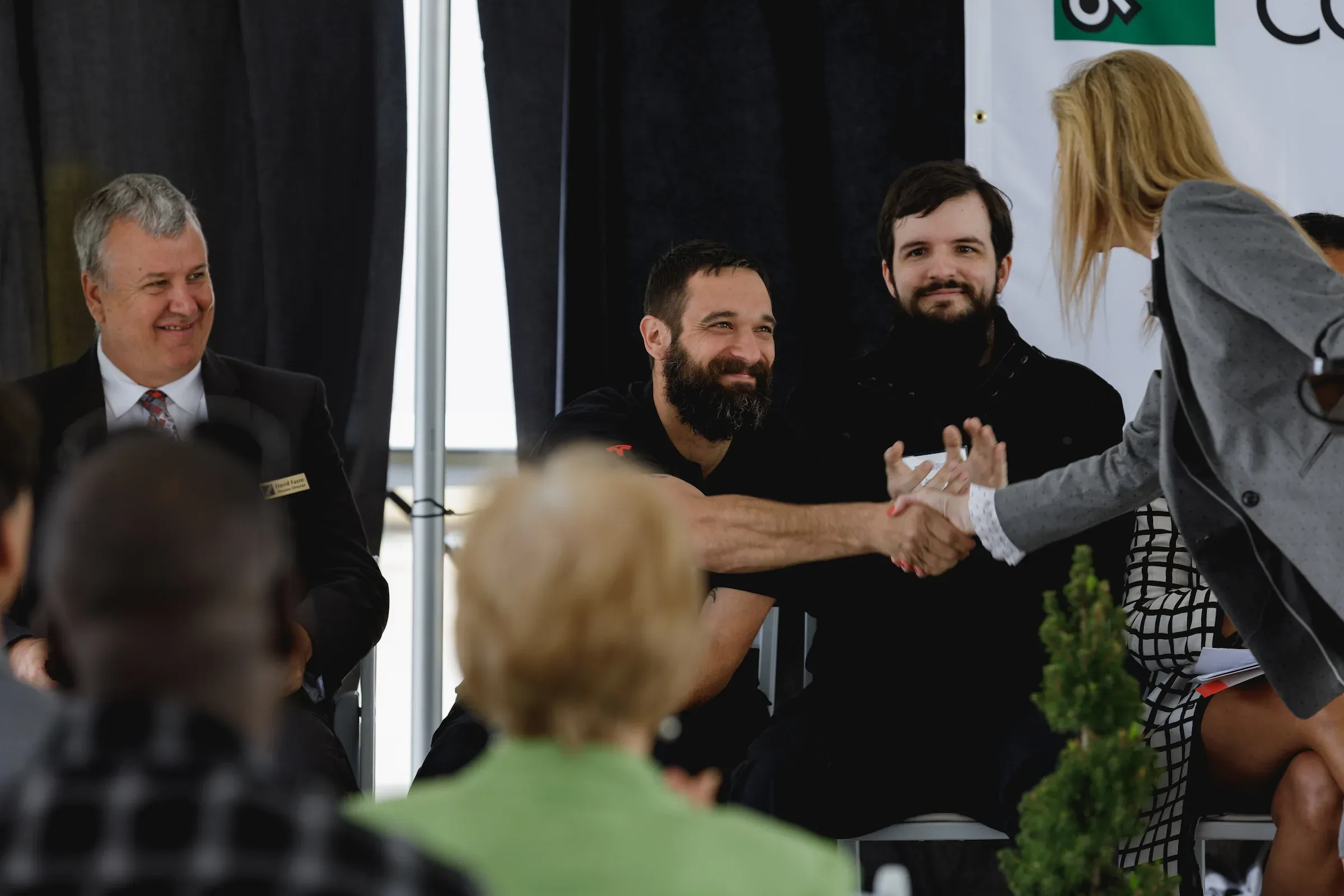 Attendees shaking hands at a networking event