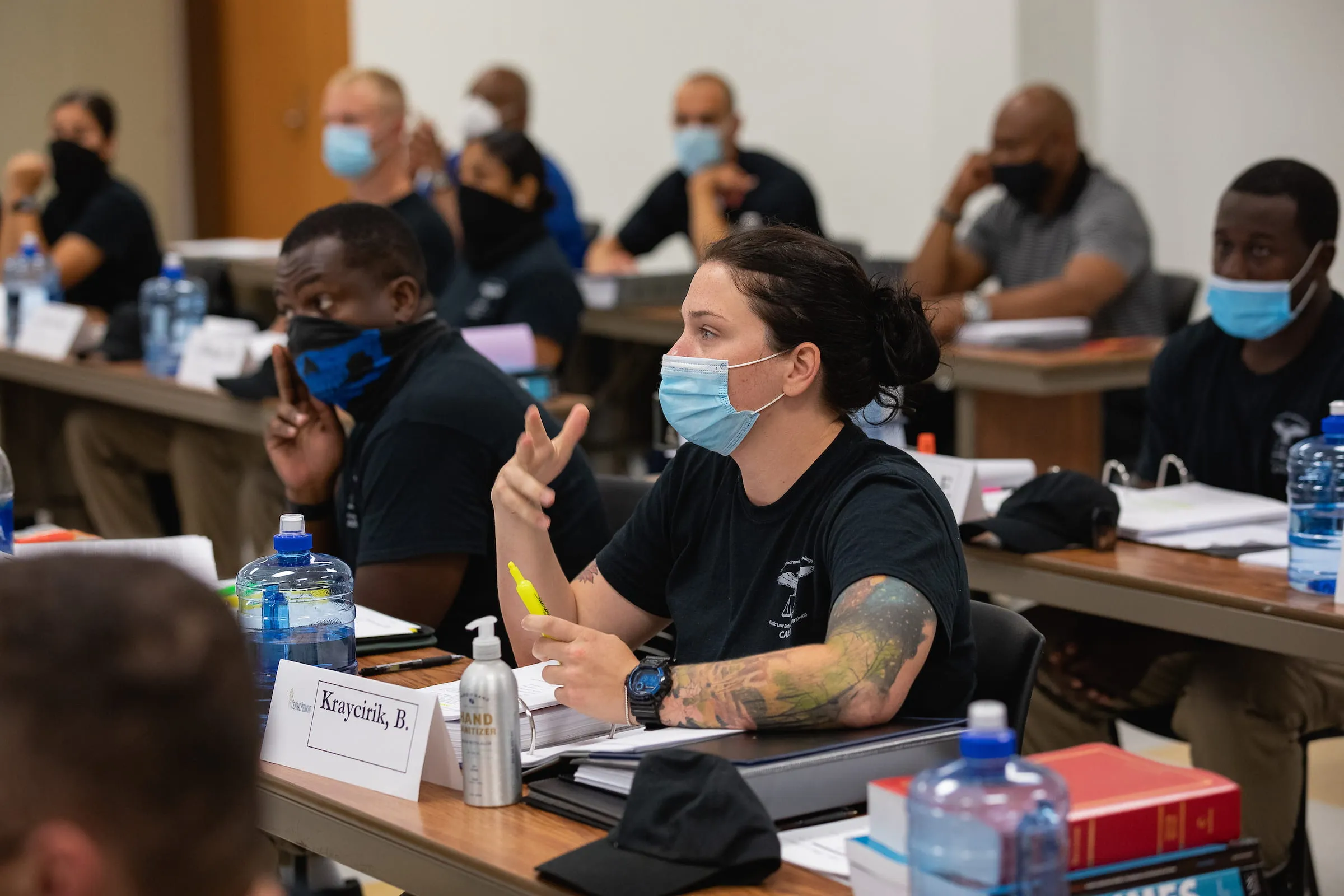 Participants asking questions during an information session