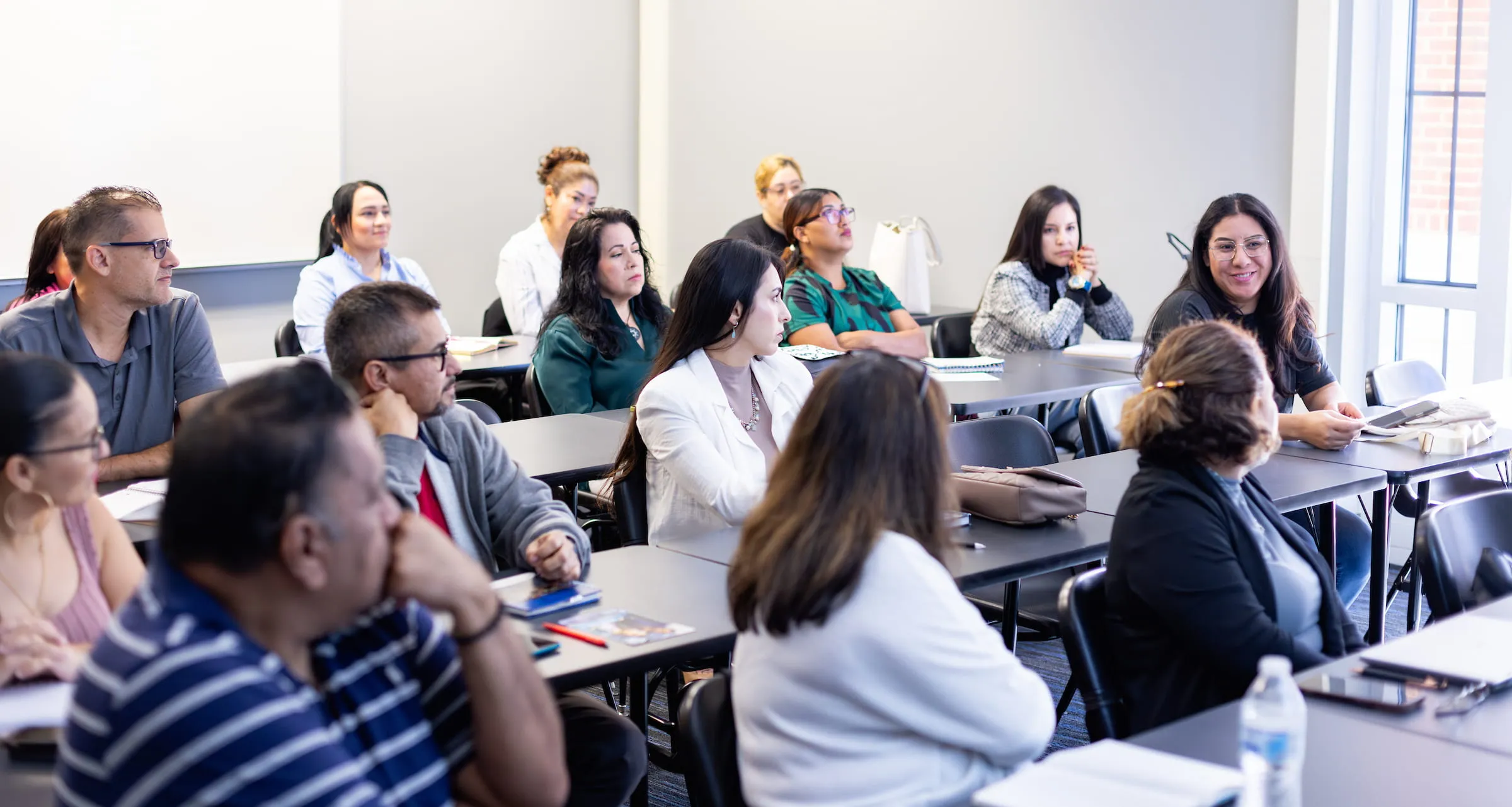 Adult students seated in a classroom during a prep class